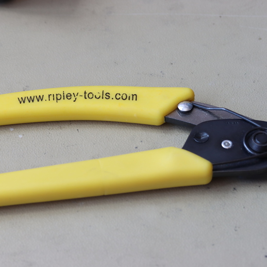 Tijera peladora de fibra óptica