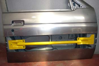 Barra de protección lateral de puerta