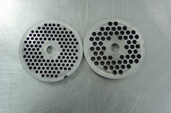 Placas de una máquina picadora de carne