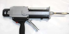 Pistola de aplicación de adhesivos bicomponentes