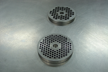 Placas de una máquina picadora de carne