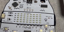Programa con MochiCard un juego moviendo tu personaje con los botones que tiene su placa.