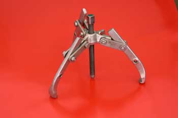 Extractor  de tres garras