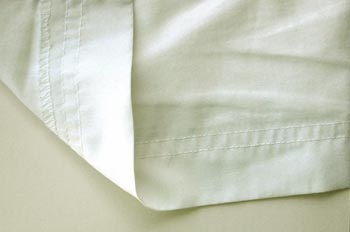 Bajo de 40mm sobrehilado y pespunte doble