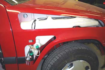 Depósito de agua y bomba de limpiaparabrisas