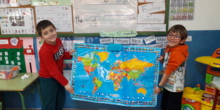 Mario and Luca-Matei are holding the World map