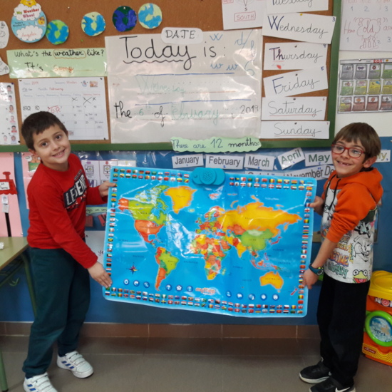 Mario and Luca-Matei are holding the World map